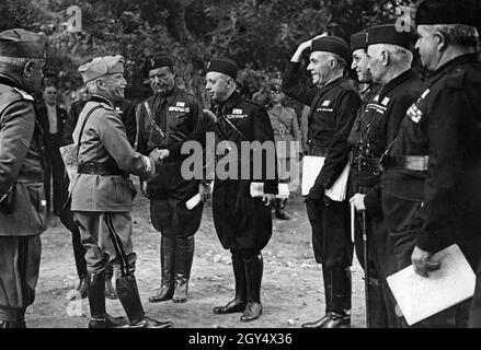 In 1936, the Italian army held a large maneuver in the region of Irpinia, part of Campania. The King of Italy, Victor Emmanuel III. (2nd from left), in uniform and with a map under his arm, inspected the troop exercises. In the picture he is received by high party officials of the Partito Nazionale Fascista (so-called gerarchi). [automated translation] Stock Photo