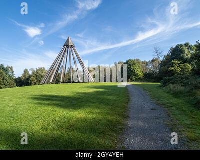 BOTTROP, GERMANY - Sep 30, 2021: Wood sculpture in Bottrop on green meadow with blue sky Stock Photo