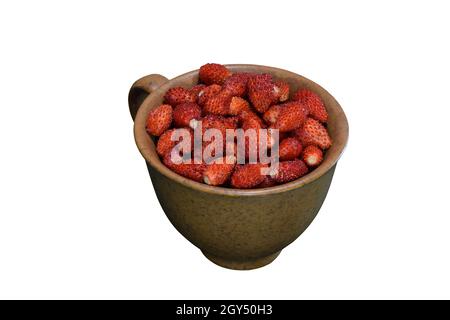 Ripe strawberries in a ceramic brown cup on a white background for clipping, shot close-up. Stock Photo
