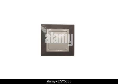 A plastic room light switch of a square shape in gray and white in the center of the frame on a white background for clipping Stock Photo