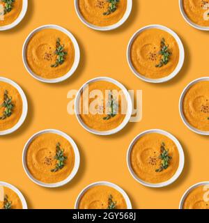 Seamless pattern of autumn Pumpkin Soup on orange background. Stock Photo