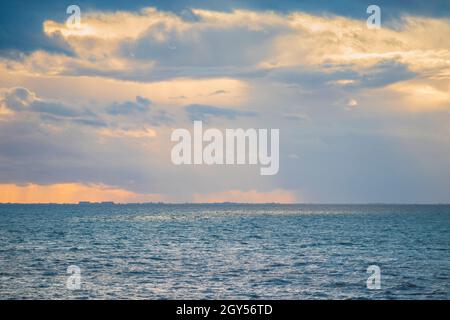 Late Afternoon Shafts of Light from Setting Sun Looking Across The Wash from Hunstanton Stock Photo