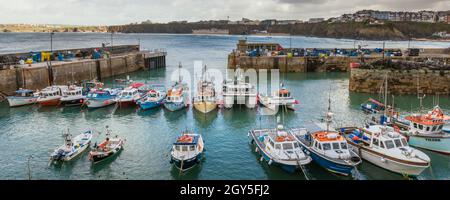 A panoramic image of the picturesque working harbour in Newquay in Cornwall. Stock Photo
