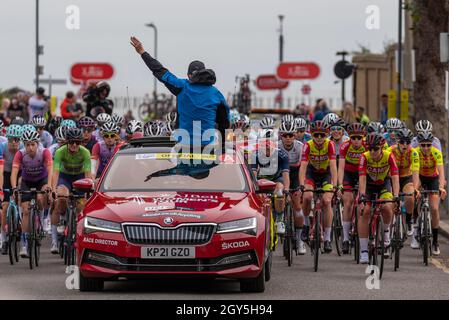 Shoeburyness, Essex, UK. 7th Oct, 2021. The fourth stage of the women’s cycle race is underway, with the start in Shoeburyness seeing the riders head out into the Essex countryside on a 117.8km course, racing towards the finish line on the seafront at Southend on Sea. Race director leading the riders through the neutral start Stock Photo