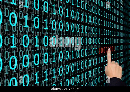 Businesswoman are pointing binary code problems. Stock Photo