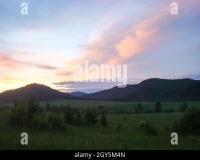 A beautiful sunset in the small bor tract. Khakassia, russia. Small Bor tract, Hakkasia. Forests and meadows Khakassia Stock Photo