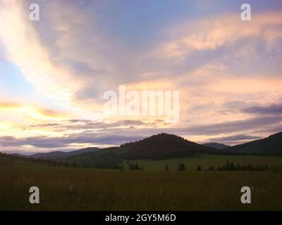 A beautiful sunset in the small bor tract. Khakassia, russia. Small Bor tract, Hakkasia. Forests and meadows Khakassia Stock Photo