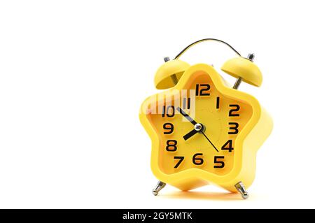 Yellow watch with five petals. Alarm clock on a white background Stock Photo