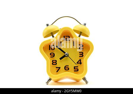 Yellow watch with five petals. Alarm clock on a white background Stock Photo