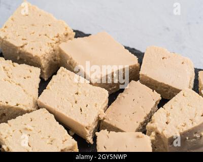 Close up view of soy cheese tofu diced. Copy space. Stock Photo