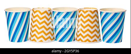 Paper disposable cups with colored pattern isolated on white background Stock Photo