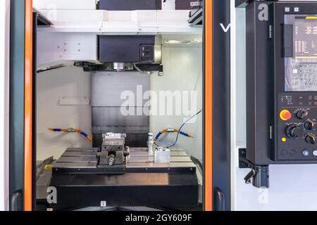 Closeup front view of numerically controlled machine tool Stock Photo