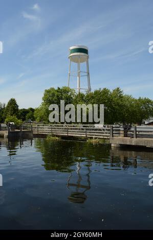 A tall white water tower located in Smiths Falls, Ontario on the Rideau Canal. Stock Photo