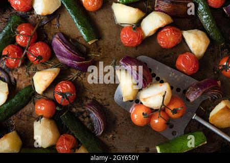 Selection of roasted vegetables on a baking tray. Stock Photo