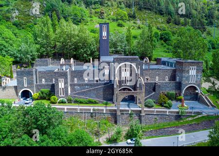 Sanctuary of Our Lady of Meritxell is a basilica located in the town of Meritxell, in the Andorran parish of Canillo, Front aerial view Stock Photo