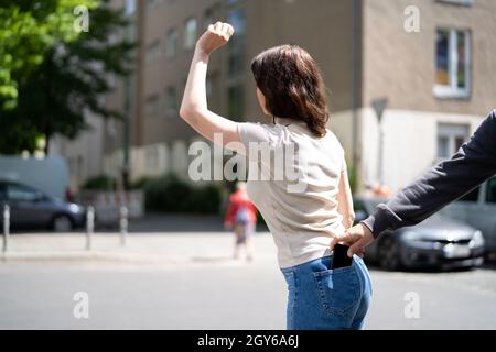 Thief Stealing Wallet From Pocket. Robbery And Theft Stock Photo