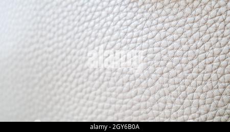 Leather texture background. Light beige ecru imitation leather sample. Abstract background with copy space, top view Stock Photo