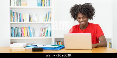 Afro american male student at online lecture at computer with copy space Stock Photo