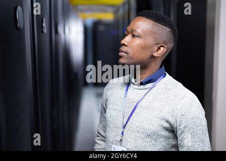 African american male computer technician working in server room Stock Photo