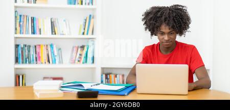 Video call of afro american male student at computer with copy space Stock Photo