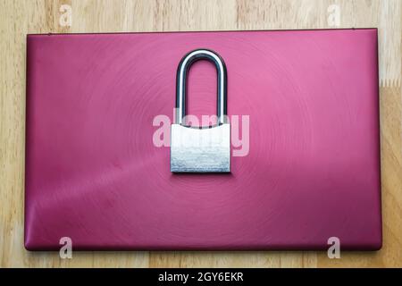 The silver padlock on laptop. The computer is cyber security. Stock Photo