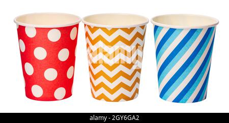Paper disposable cups with colored pattern isolated on white background Stock Photo