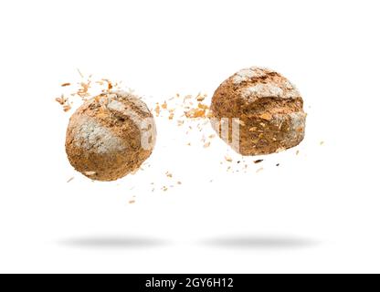 Bread jumping with crumbs on white background Stock Photo