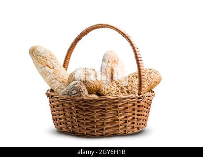 assortment of baked bread in wicker basket on white background Stock Photo