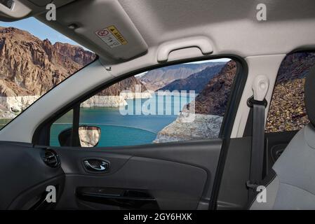 Looking through a car window with view of Colorado river in front of the Hoover Dam on the Nevada side, USA Stock Photo