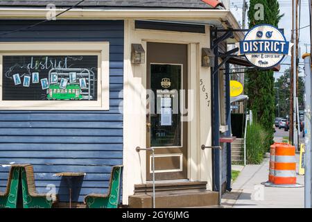 NEW ORLEANS, LA, USA - MAY 23, 2021: Entrance to popular District Donuts shop on Magazine Street