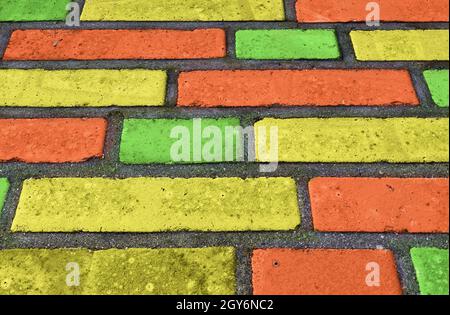 Beautiful rainbow colored bricks on an old vintage wall texture Stock Photo