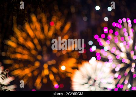 Colorful firework. Amazing fireworks with bokeh from drops on the lens, fireworks 2019, fireworks background, fireworks event, Celebration in the town Stock Photo