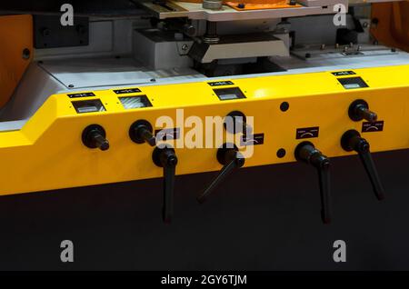 Operator machining automotive part by turning machine, Industry machine background. Stock Photo