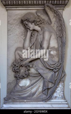 GENOA, ITALY - June 2020: antique statue of angel (beginning 1900, marble) in a Christian Catholic cemetery - Italy Stock Photo