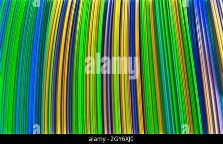 Multi-colored shades of blue and pink pattern of thin undulating lines arranged diagonally. Stock Photo