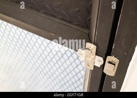 Black grunge door in loft room, stock photo Stock Photo