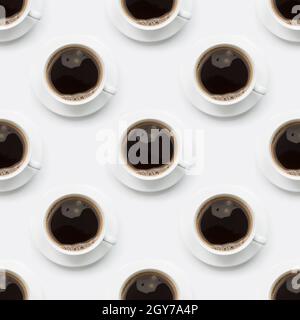 Seamless pattern of black coffee in white cup on white background. Stock Photo