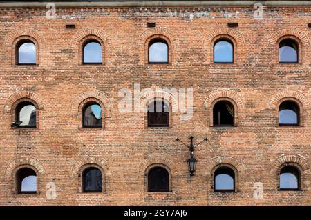 Facade of restored medieval granary on the Olowianka island in the old town of Gdansk Stock Photo