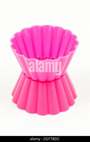Pink silicone cake cups isolated on white background Stock Photo