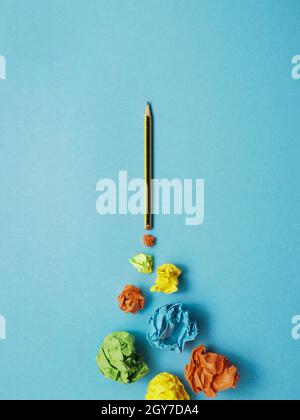 Launching pencil rocket with jet stream of paper balls, creativity concept or new ideas metaphor, start up business , new years resolution Stock Photo