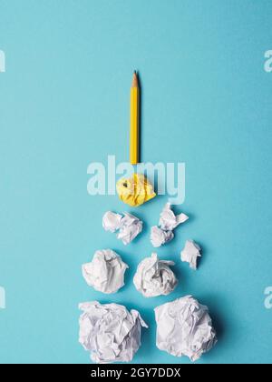 Launching pencil rocket with jet stream of paper balls, creativity concept or new ideas metaphor, start up business , new years resolution Stock Photo