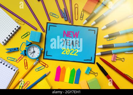 Conceptual display New Year 2022, Business overview Greeting Celebrating Holiday Fresh Start Best wishes Flashy School And Office Supplies Bright Teac Stock Photo