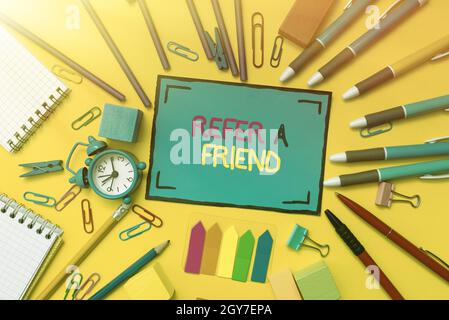 Writing displaying text Refer A Friend, Word Written on direct someone to another or send him something like gift Flashy School And Office Supplies Br Stock Photo