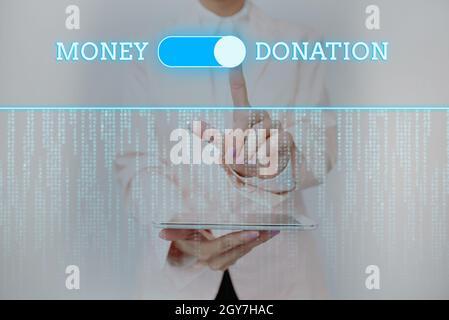 Text sign showing Money Donation, Business idea a charity aid in a form of cash offered to an association Inspirational business technology concept wi Stock Photo