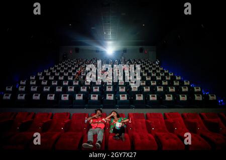 Kathmandu, Nepal. 7th Oct, 2021. People watch a movie at a theater after halls reopen after 18 months due to the COVID-19 pandemic at One Cinemas at New Baneshwor in Kathmandu, Nepal. (Credit Image: © Skanda Gautam/ZUMA Press Wire) Stock Photo