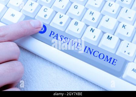 Text sign showing Passive Income, Concept meaning earnings extracted from rental property, and other enterprises Abstract Typing Presentation Message, Stock Photo