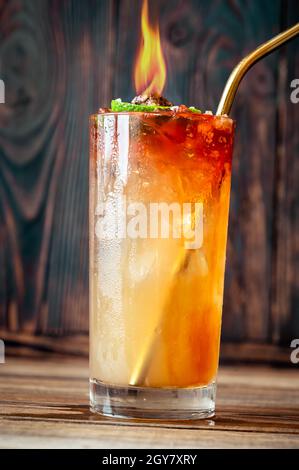 Glass of Holy water cocktail on the wooden background Stock Photo