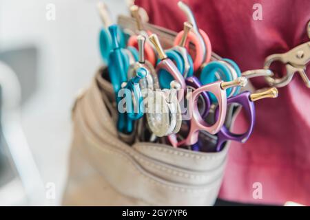 Set of hairdresser. Barber tools are attached to the belt. Stock Photo
