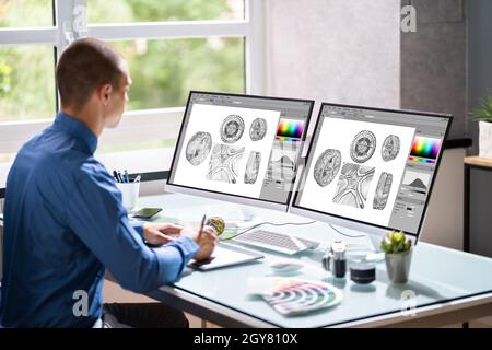 Graphic Web Designer Artist Using Computer To Design Stock Photo