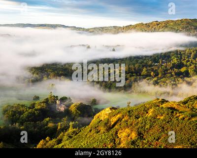 Morning mist below Black Fell from Todd Crag at dawn, Lake District, UK. Stock Photo